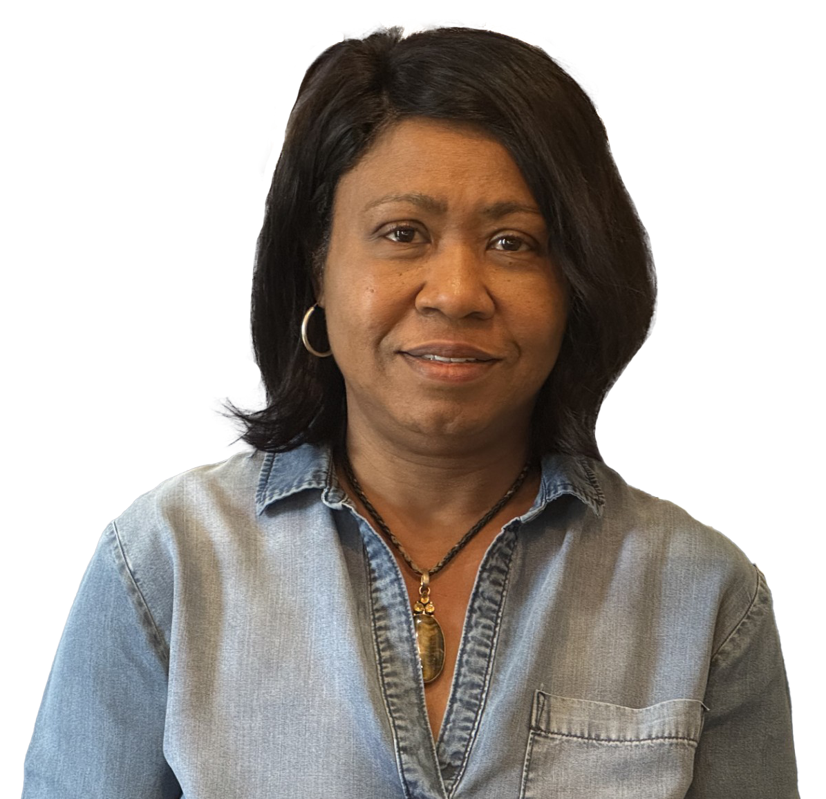 A woman wearing a black jacket and a necklace smiles for the camera