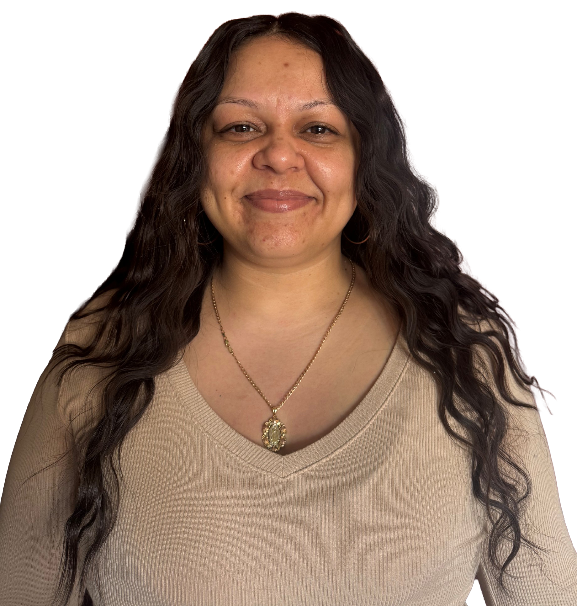 A woman wearing a white shirt and a black cardigan smiles for the camera