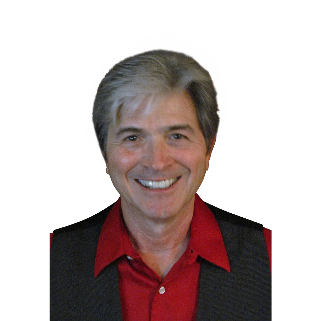 A man in a red shirt and black vest smiles for the camera