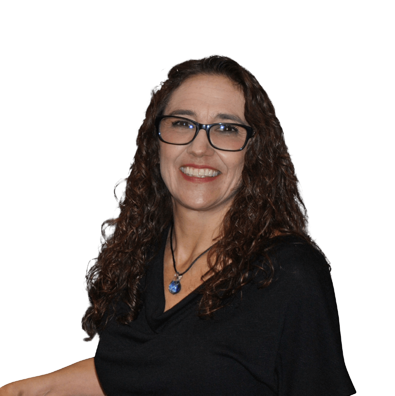 A woman wearing glasses and a necklace smiles for the camera