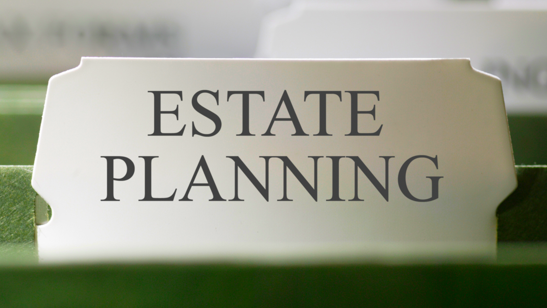 A white sign that says estate planning on it