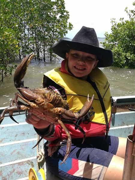 kid holding crab