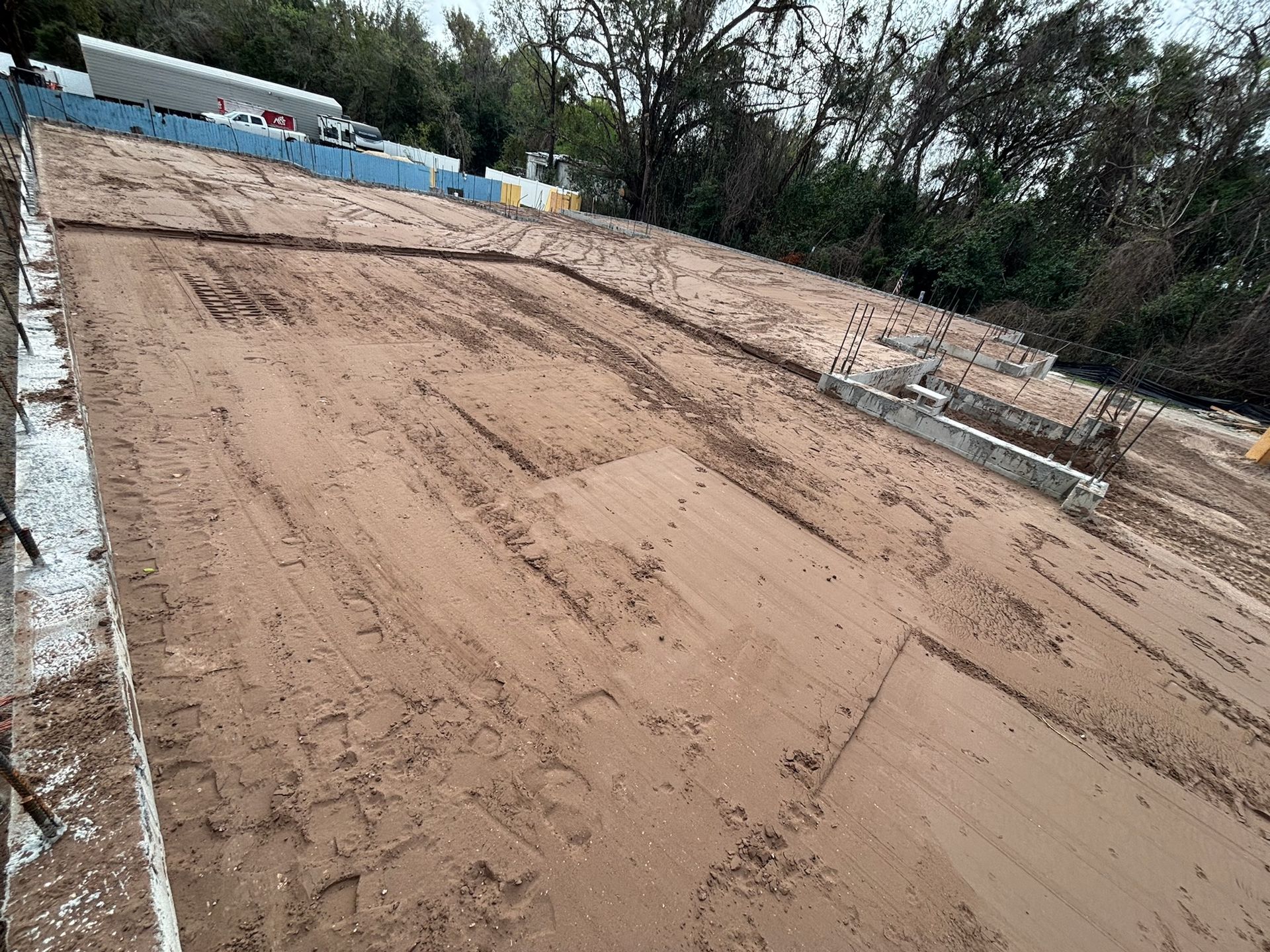 A large pile of dirt is sitting on top of a dirt field.