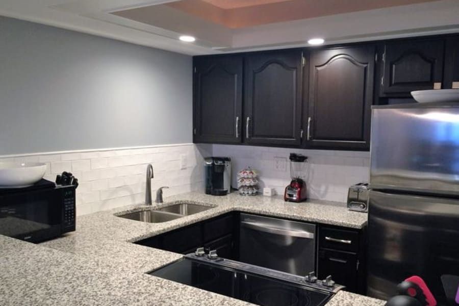 A kitchen with stainless steel appliances and granite counter tops