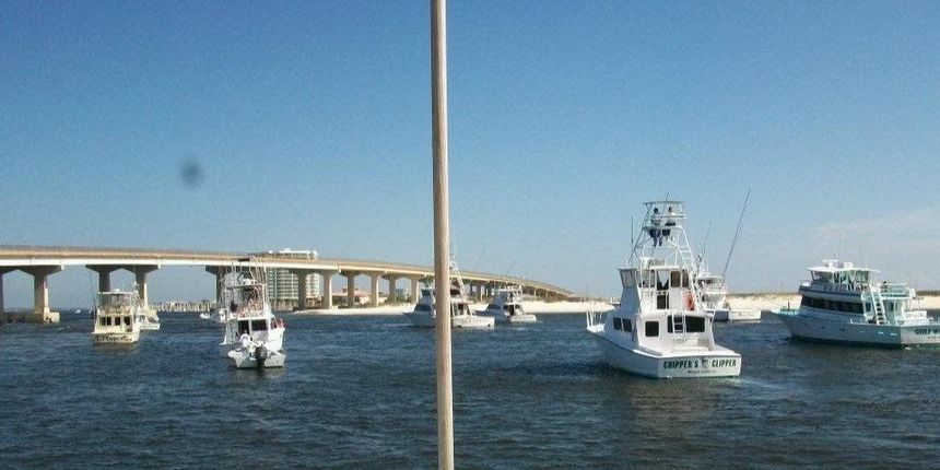 A bridge over a body of water with boats in the water