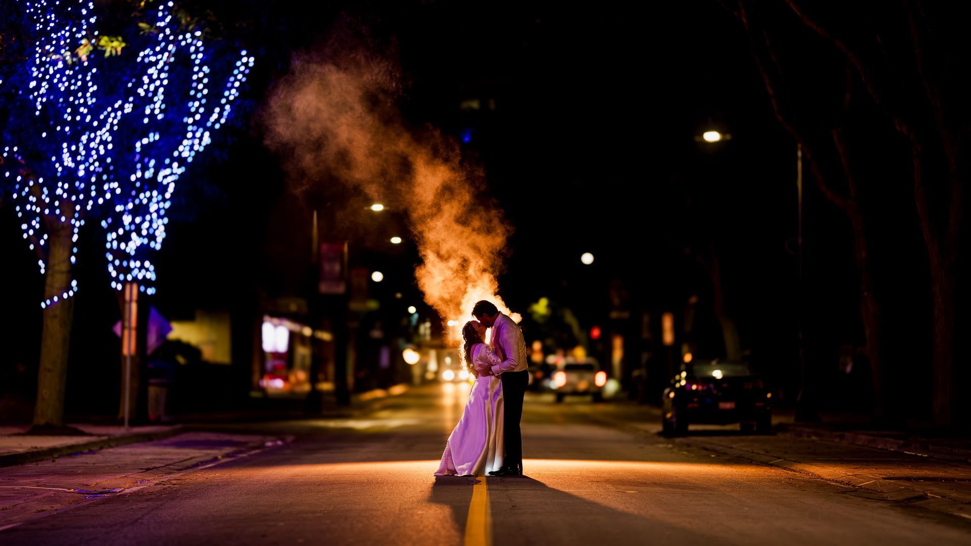 Wedding at the retro suites, Brian Groom outside on street night shot photography smoke behind