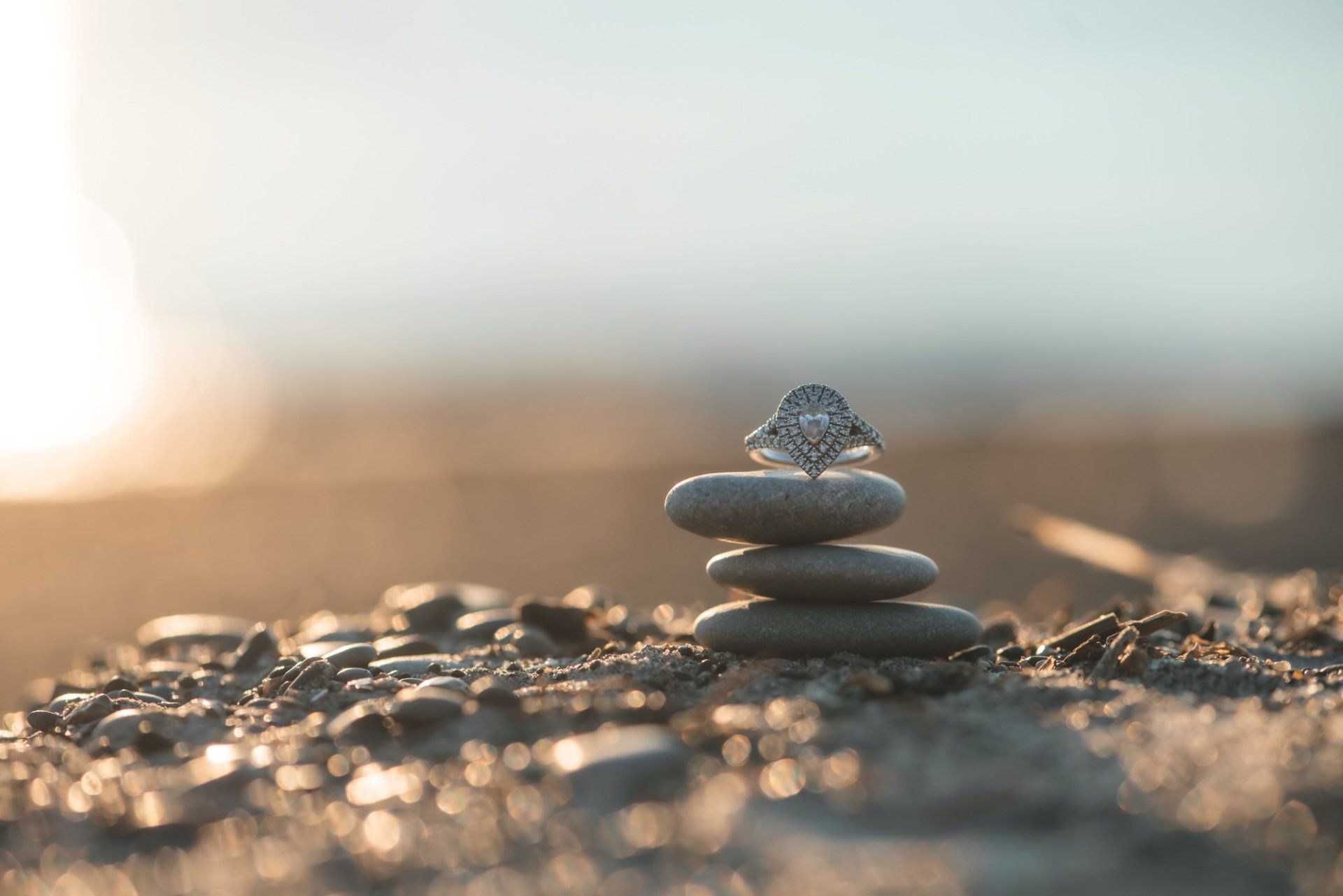 A stack of rocks with a diamond in the middle.