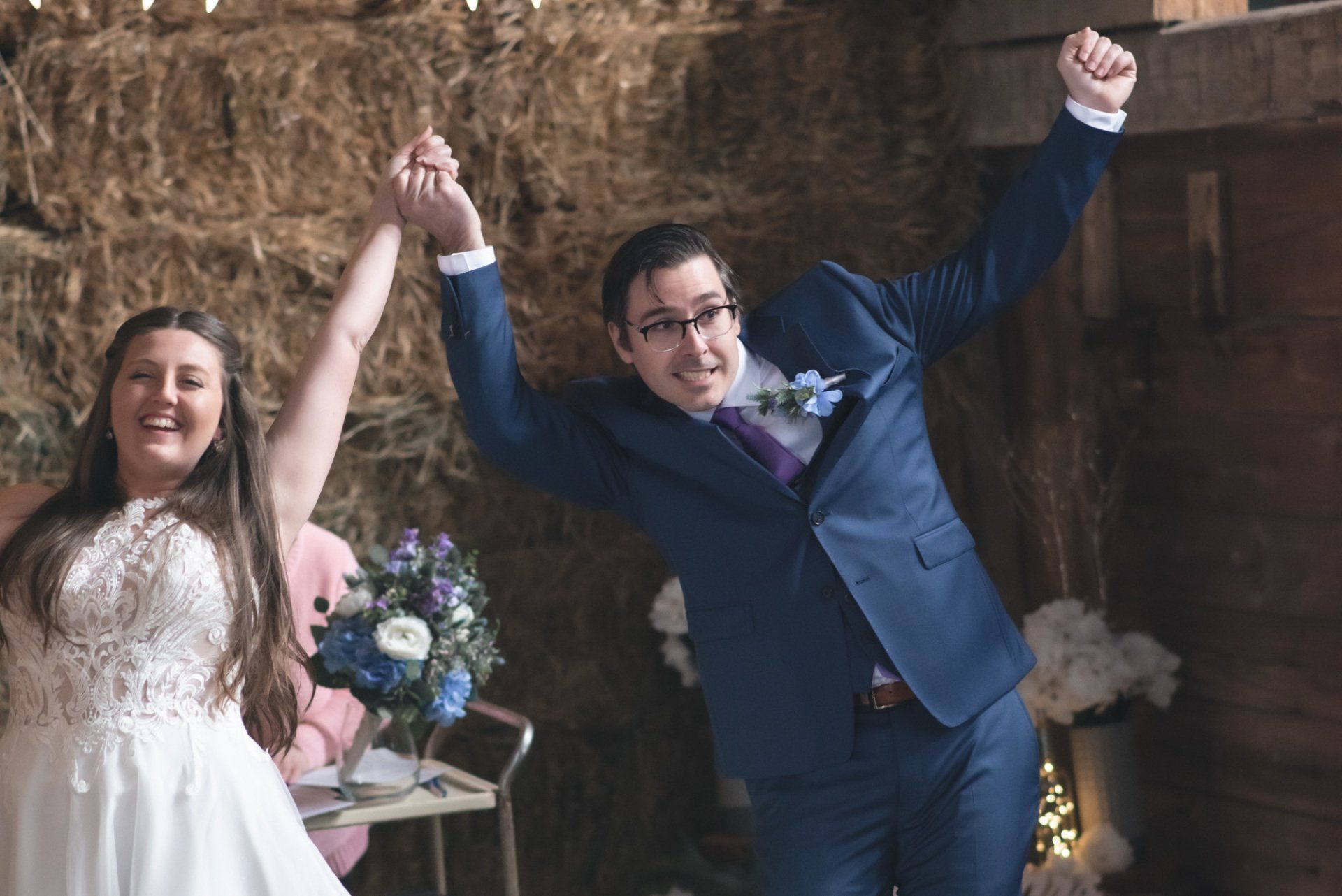 A bride and groom are holding hands and celebrating their wedding.