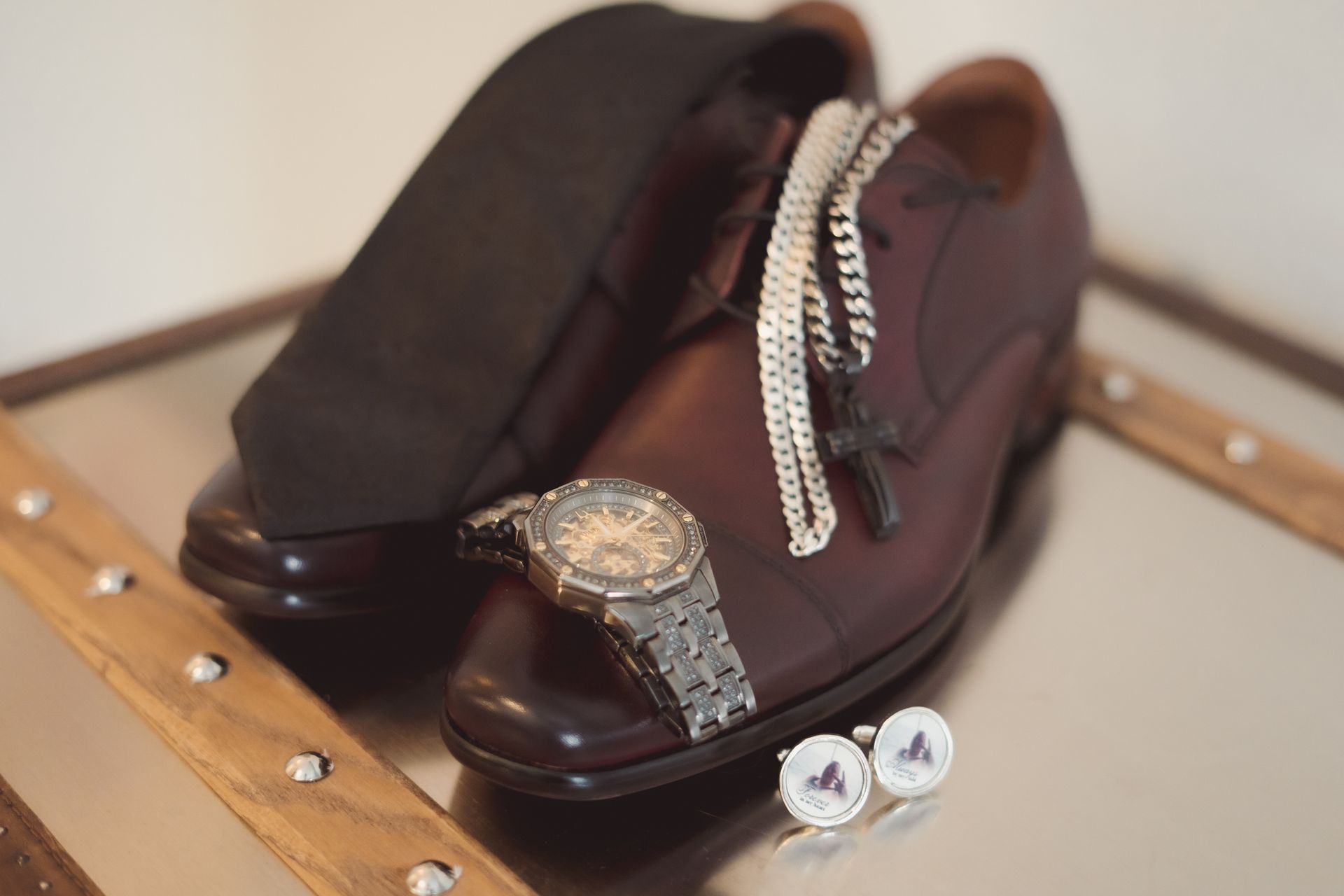Detailed shots of shoes, watch cufflinks and necklace,Retro Suites Hotel, vintage wedding