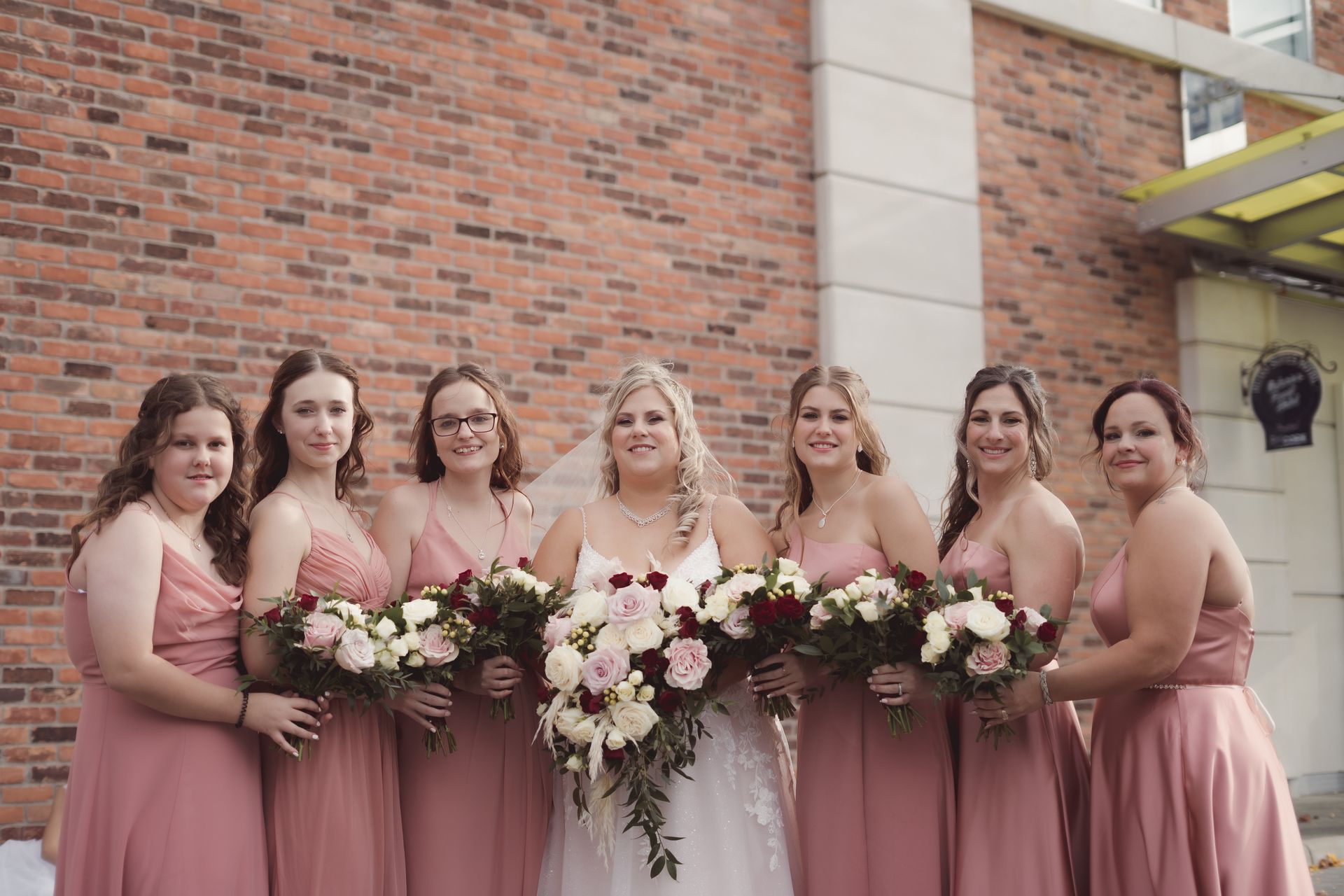 bride and bridesmaids wedding party photo with bouquets out in front, Retro Suites Hotel, vintage wedding