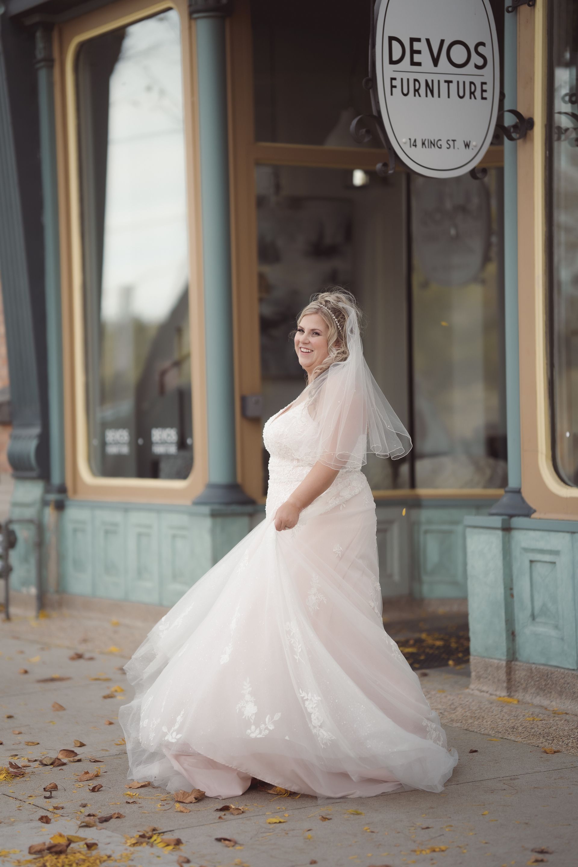 bride dancing in front of stores, Retro Suites Hotel, vintage wedding