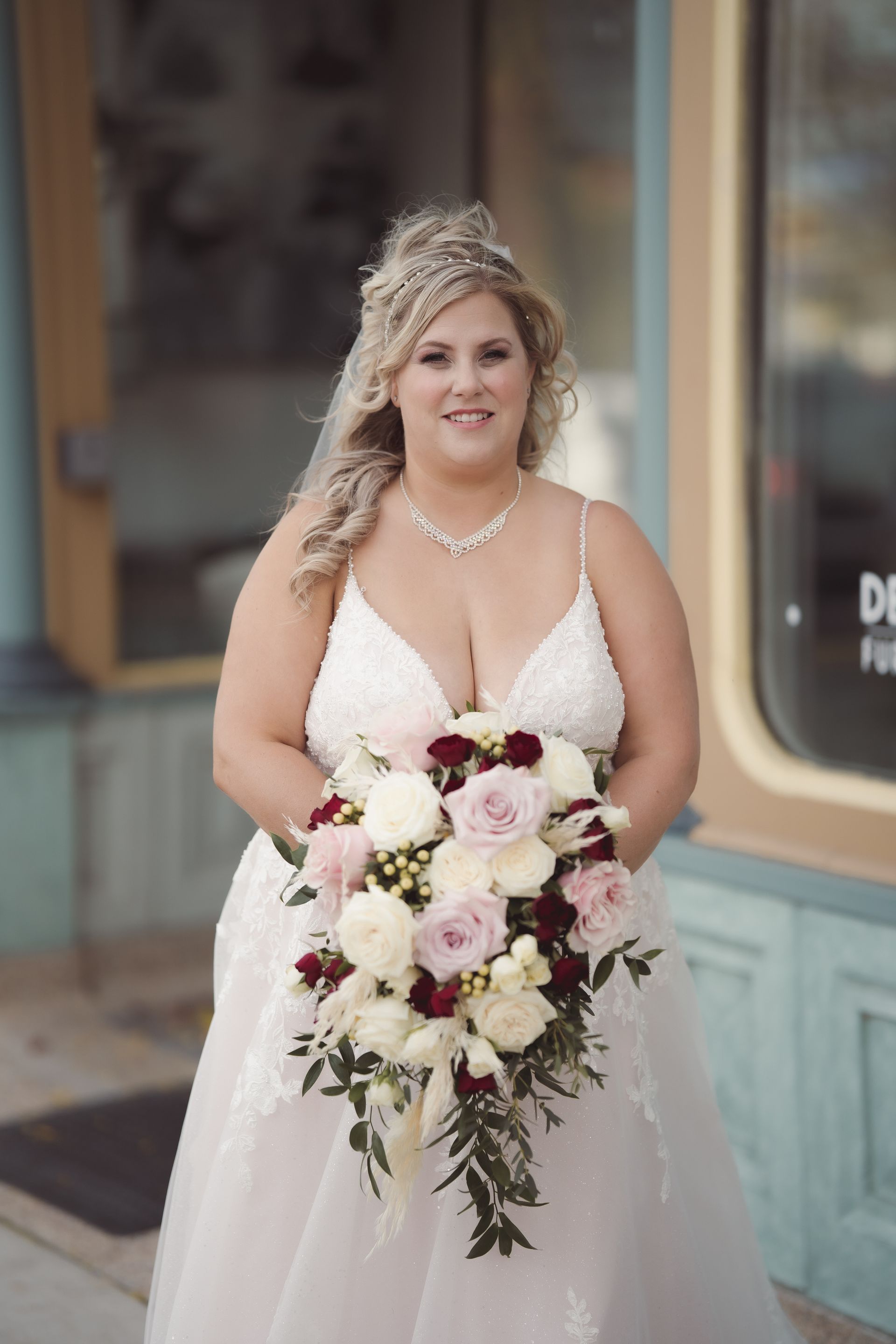 Portrait of bride, holding bouquet, staring directly into camera, Retro Suites Hotel, vintage wedding