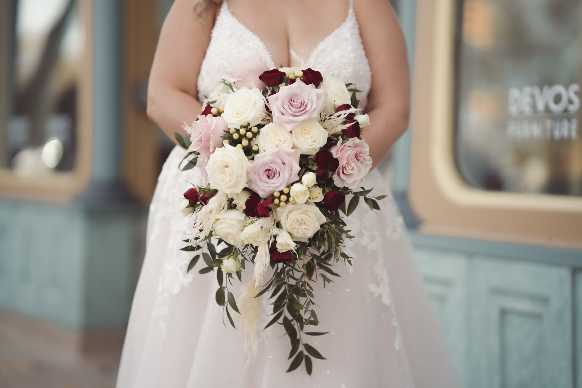 Photo of brides bouquet as she's holding it, Retro Suites Hotel, vintage wedding