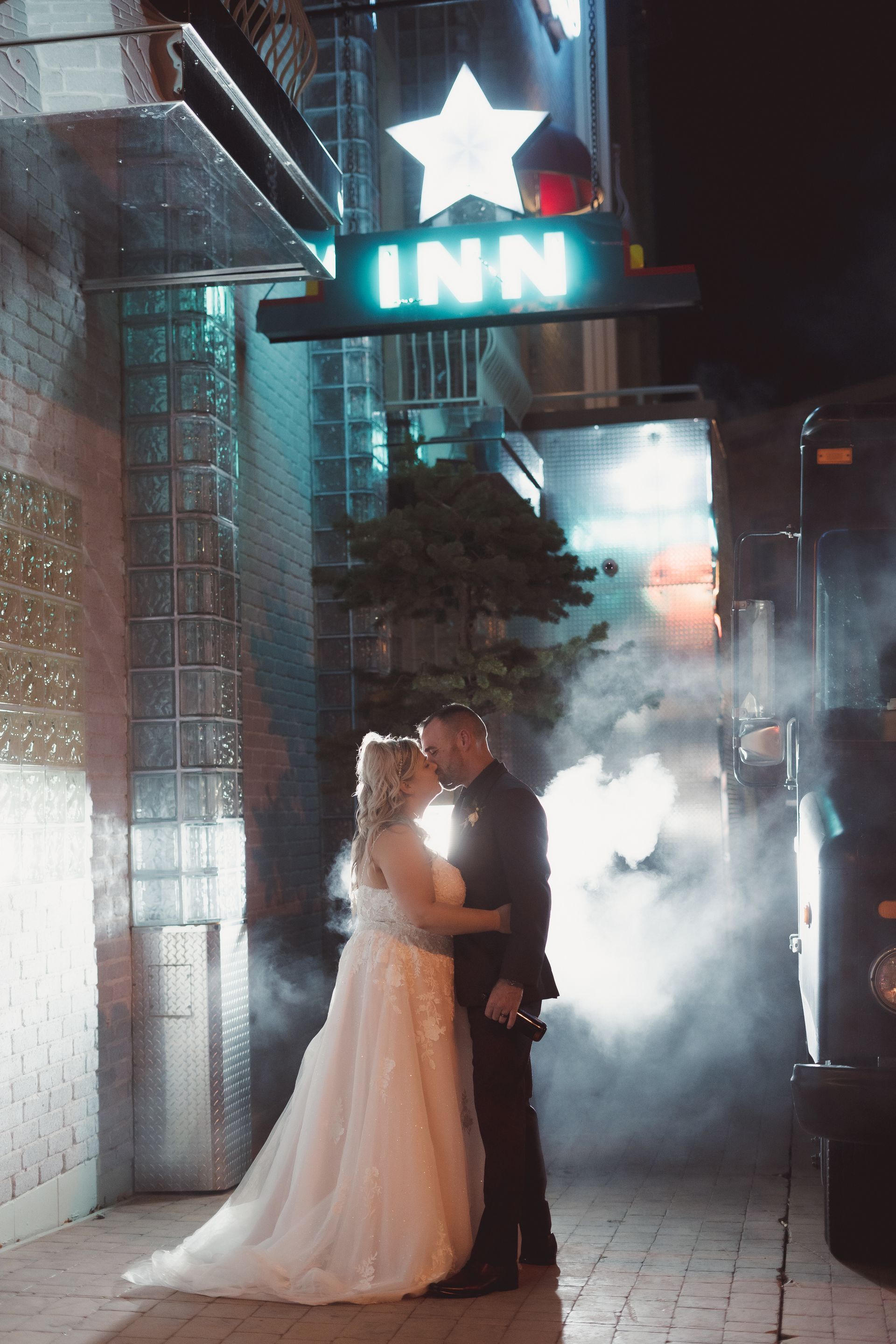 bride and groom night shot photography flash behind smoke behind them, Retro Suites Hotel, vintage wedding