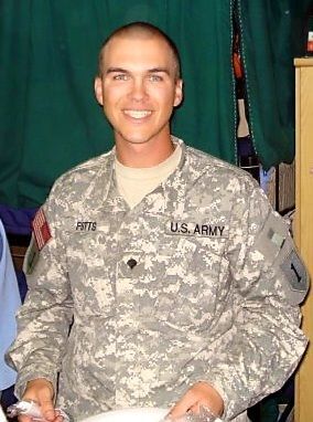 A man in a us army uniform is smiling