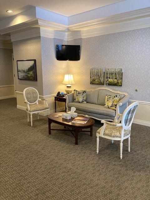 Interior view with couch, two chairs and coffee table at
K.E. Pike Funeral Home in Cedar Springs, MI