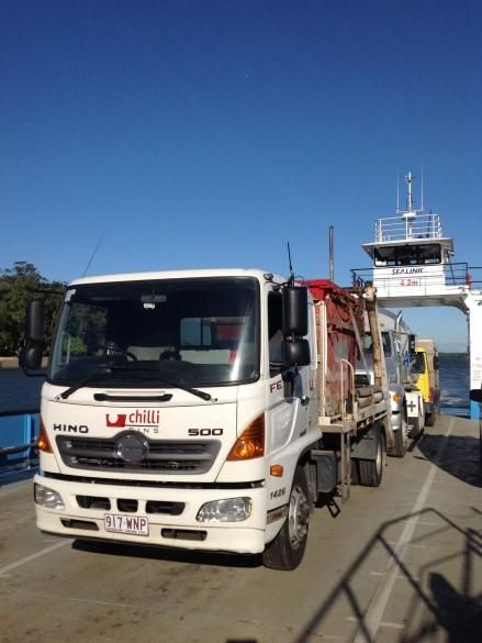 A White Truck with The Word Hino on The Front — Chilli Bins Skip Bins in Glenview, QLD