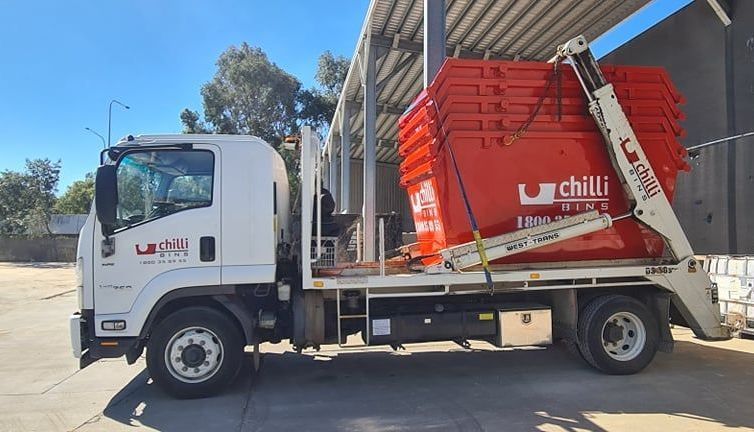 Stack of Five Skip Bins on Truck— Chilli Bins Skip Bins in Glenview, QLD
