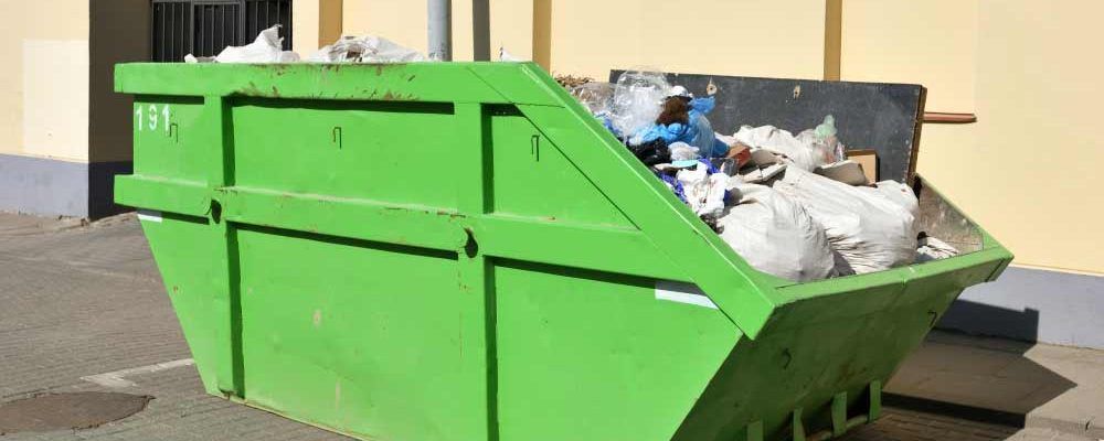 Green Skip On The Street Collecting Community Waste — Chilli Bins Skip Bins in Glenview, QLD