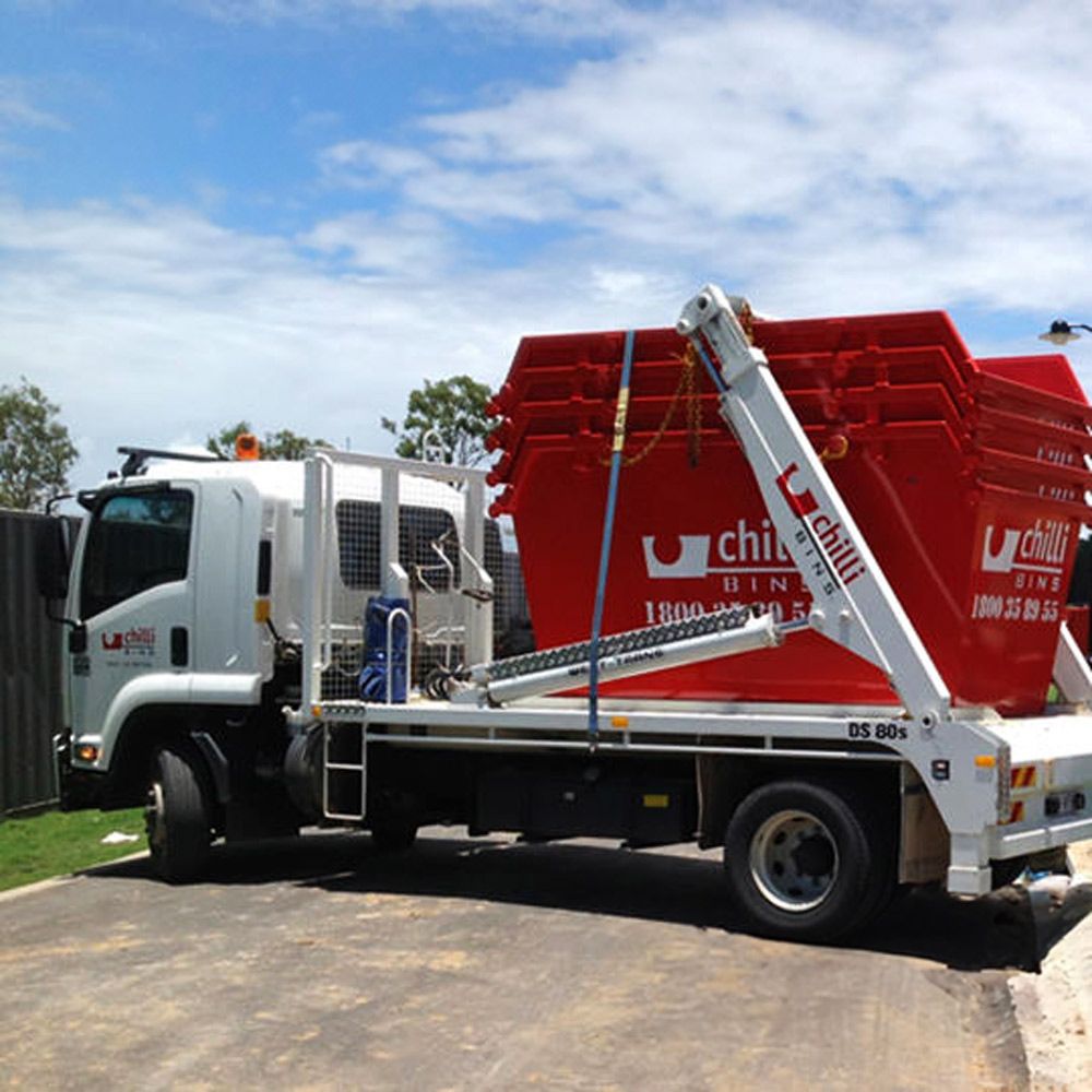 Truck With A Of Skip Bins At The Back