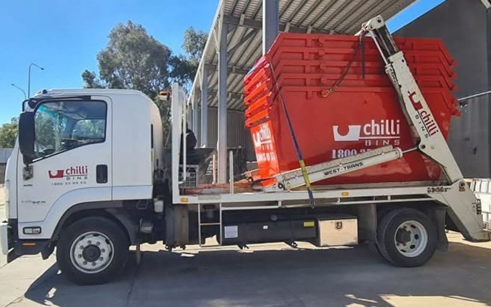 Affordable Skip Bins at The Back of A Delivery Truck