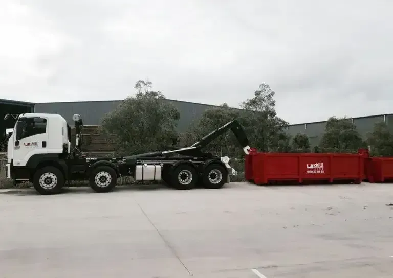 Two Skip Bins Getting Dropped on to Industrial Site — Chilli Bins Skip Bins in Glenview, QLD