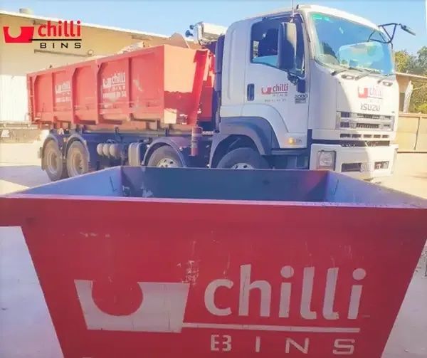 Red Dumpster Sitting In Front Of Truck — Chilli Bins Skip Bins in Burpengary, QLD