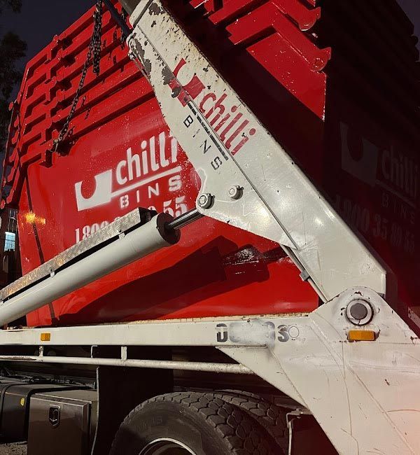 Skip Bins Loaded On A Vehicle