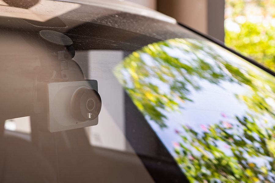 a camera attached to the side of a car