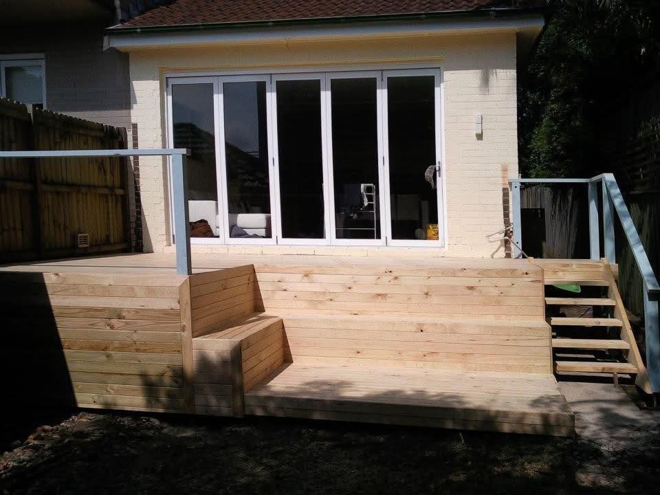 Wooden Deck With Steps Leading Up to Glass Doors — Truecraft Services in Biboohra, QLD