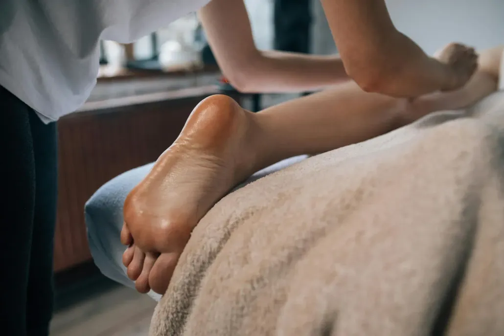Close-up of professional foot massage and reflexology.