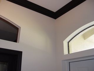 There is a window in the corner of the room.