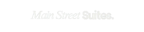 Faint white “Mira Street Suites” text on a light background