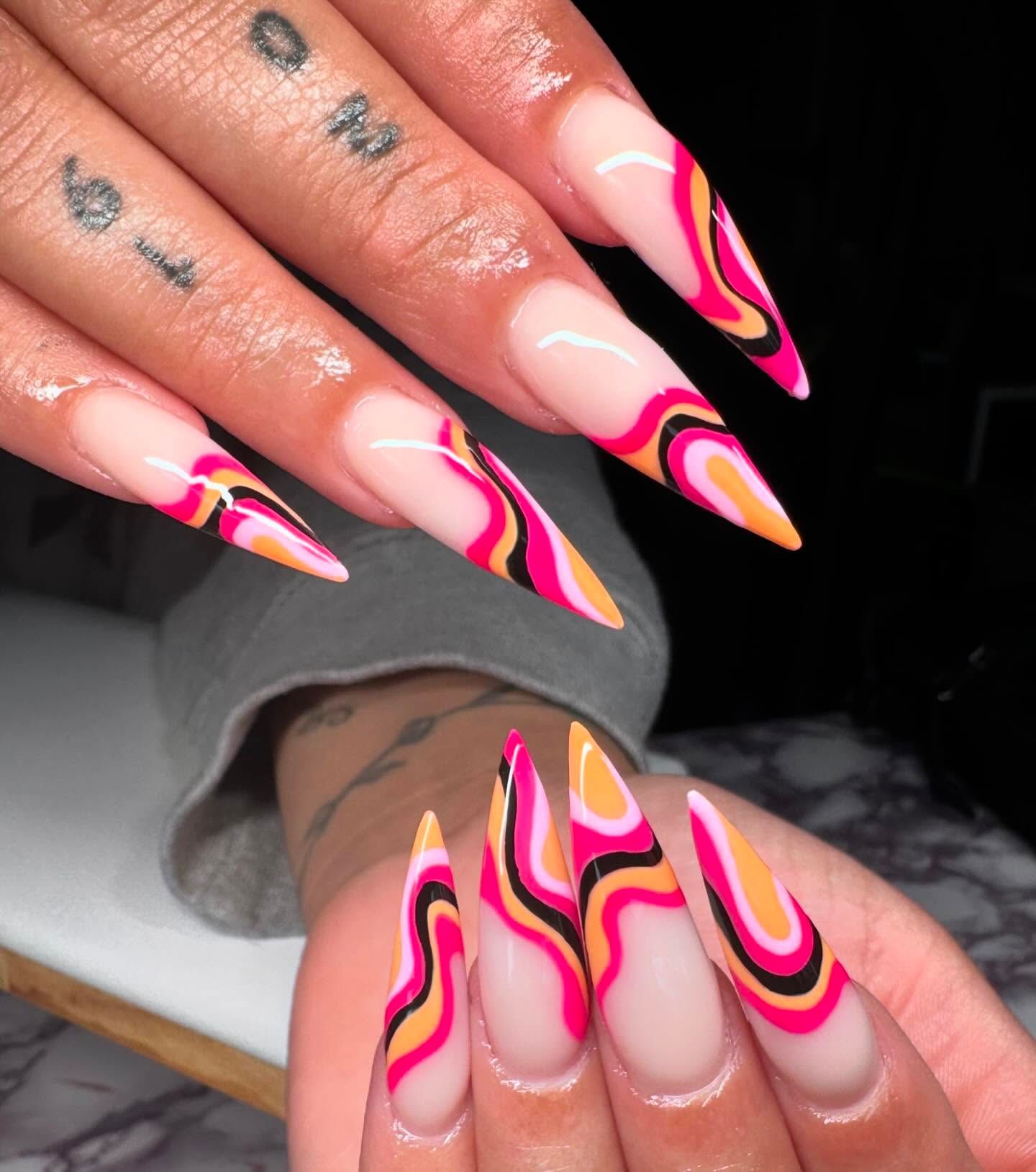 Pink, orange, and brown abstract nail design