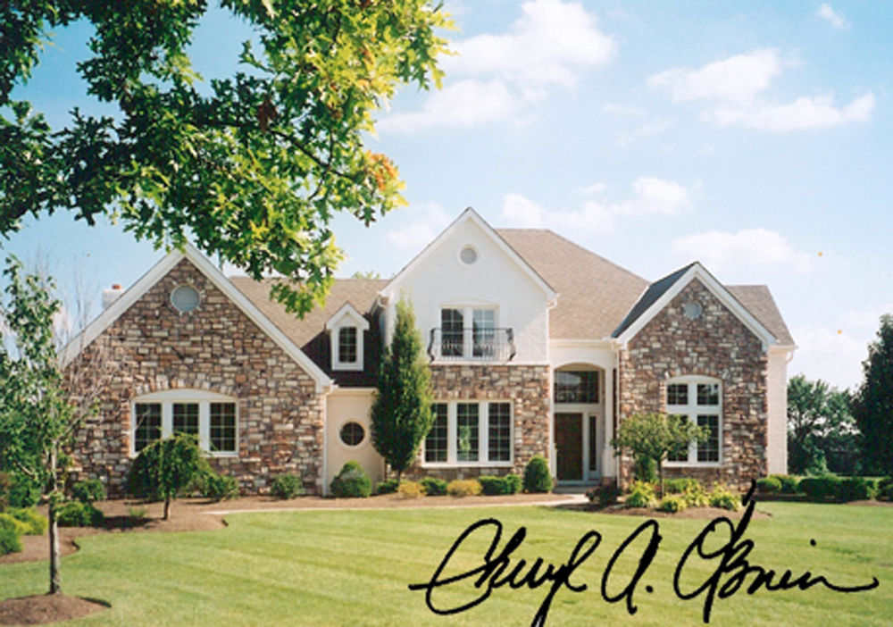 A picture of a house with a signature on it