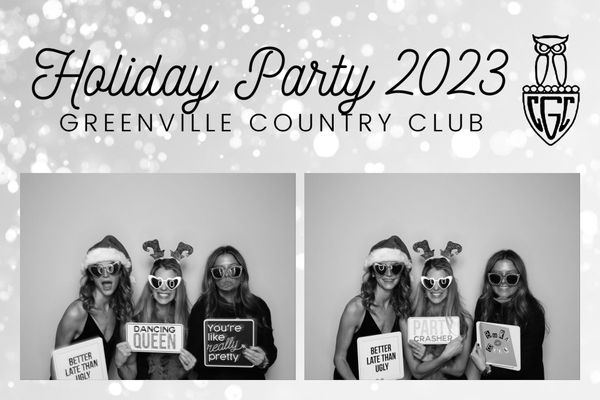A group of women are posing for a picture in a photo booth for a holiday party.