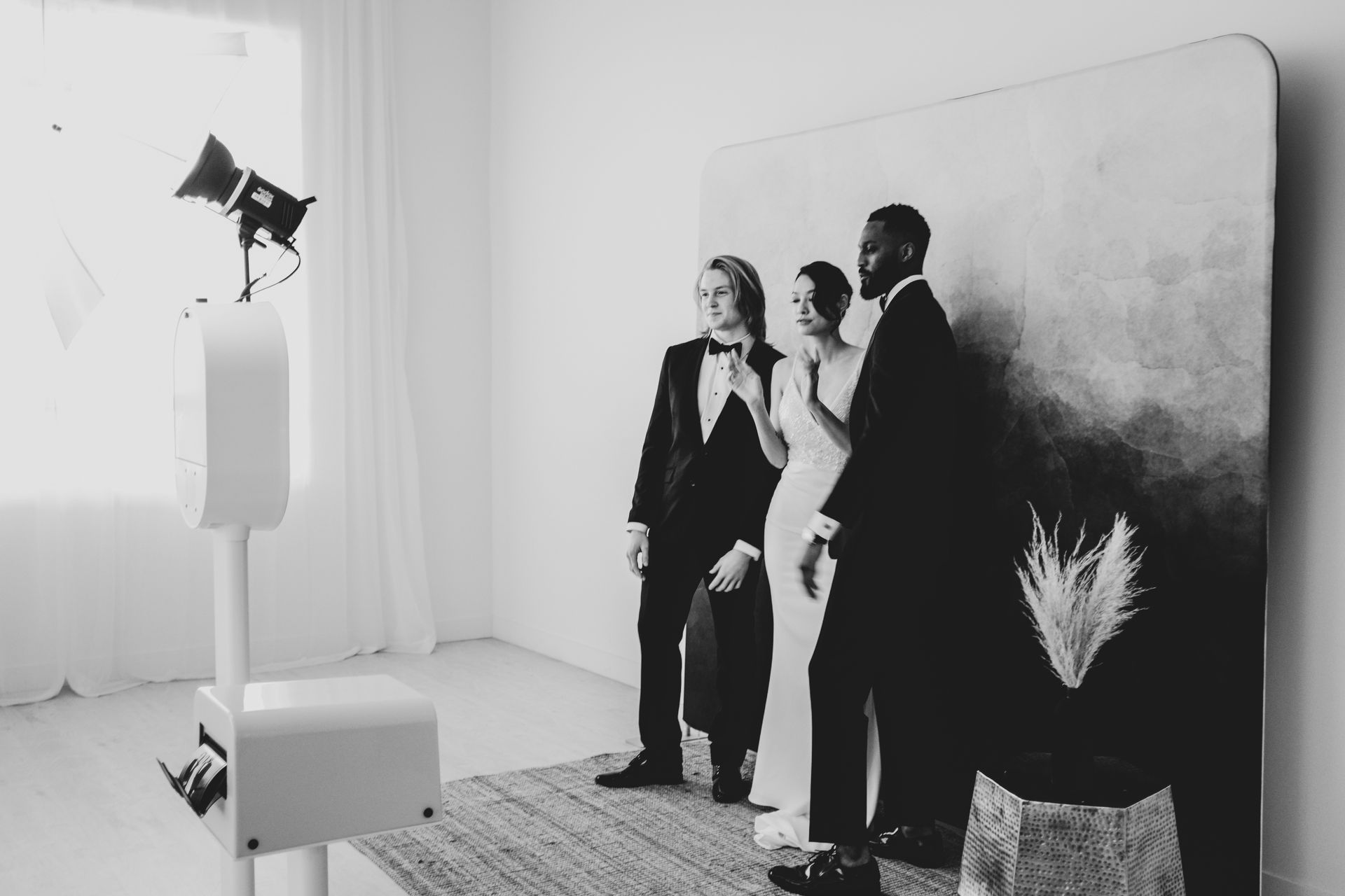 a group standing in front of photo booth