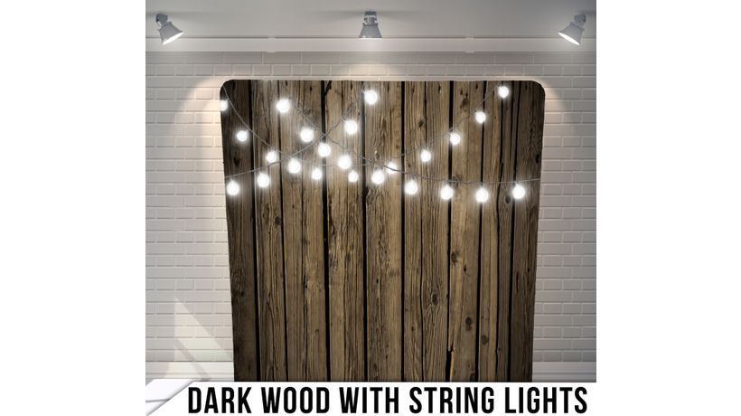 A dark wood background with string lights on it.