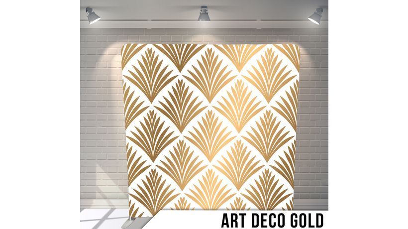 A white wall with a gold pattern on it.