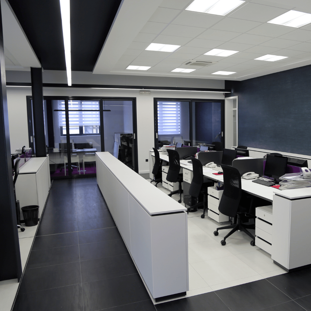 A large office with a lot of desks and chairs