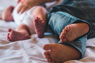 baby and dad feet
