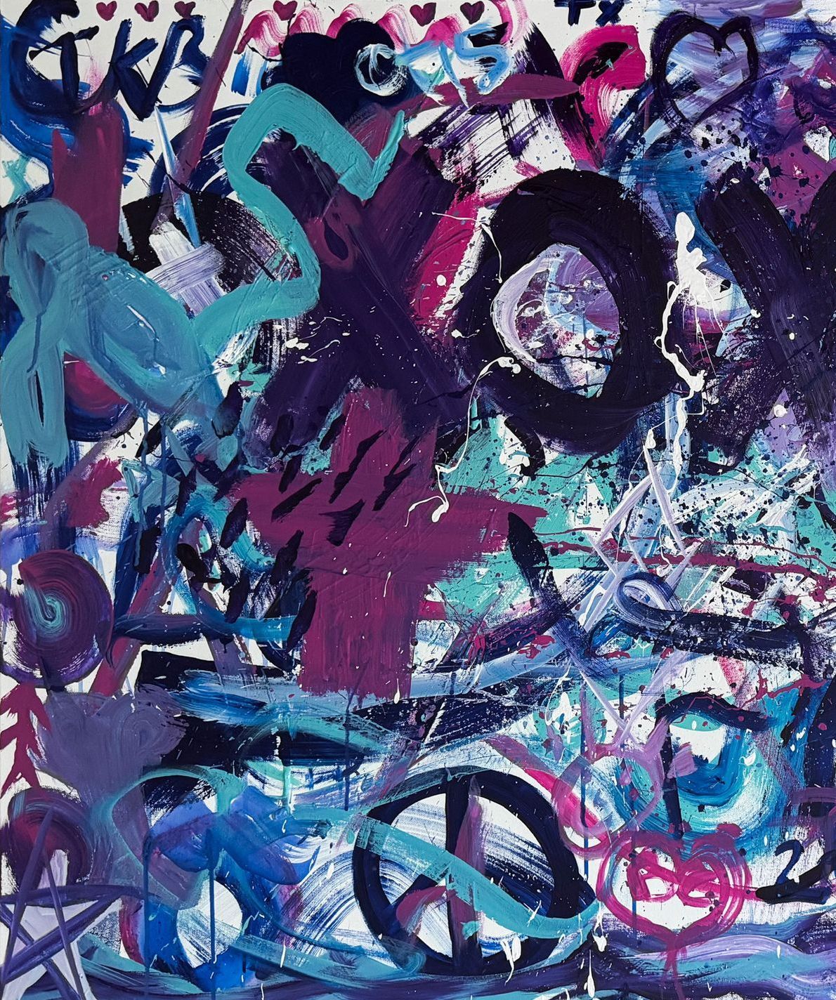 A close up of a colorful painting with graffiti on it.