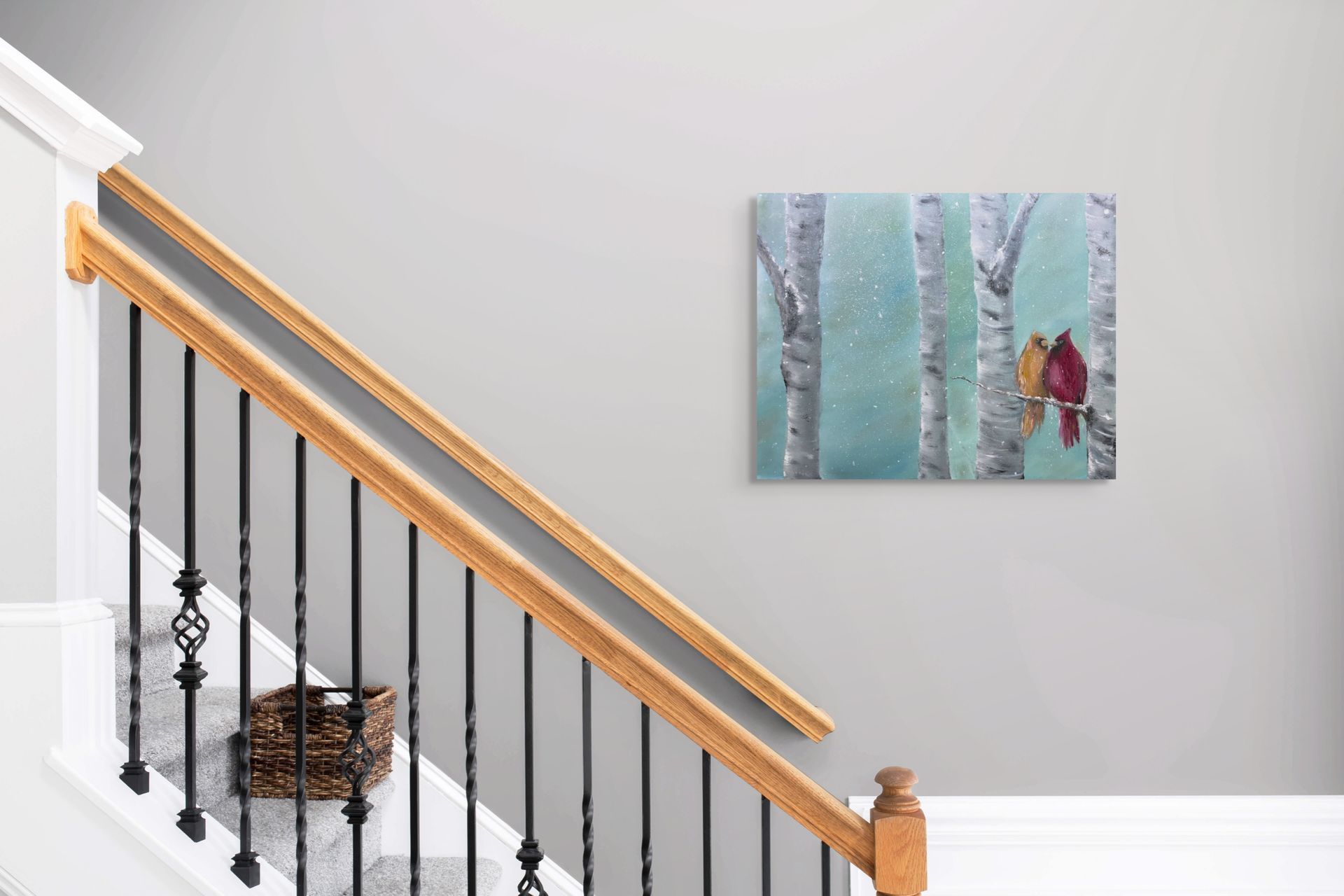 A living room with a couch and a painting on the wall