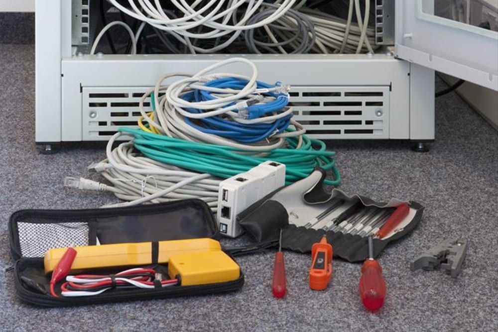 Cables and Tools for Network Maintenance Are in Front of a Rack Server — IRIS CCTV in South Grafton, NSW