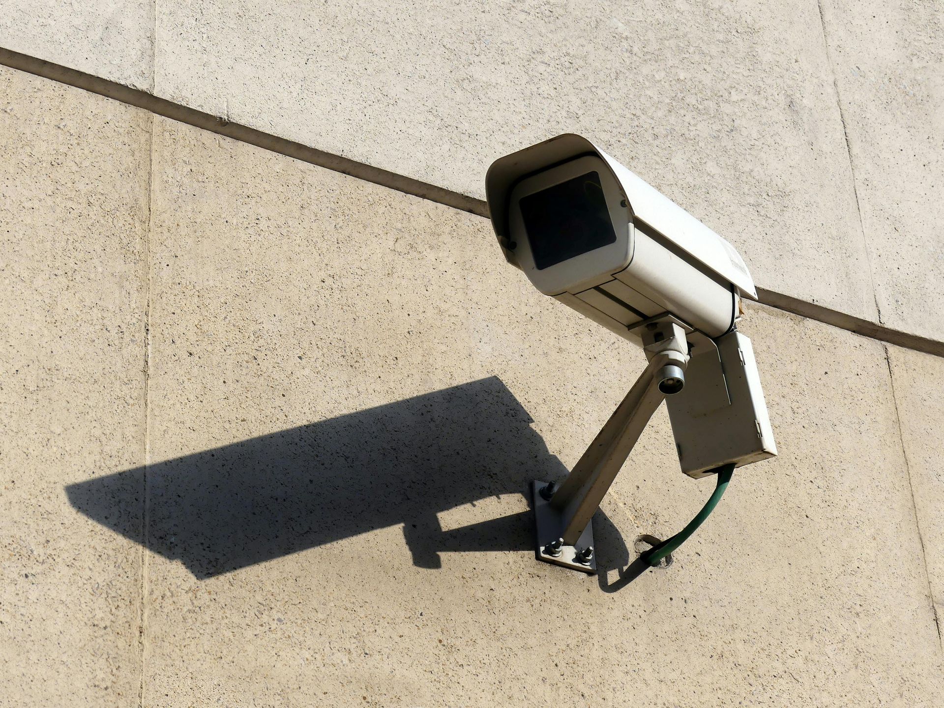Security Camera Mounted on a Light Beige Textured Wall — IRIS CCTV in South Grafton, NSW