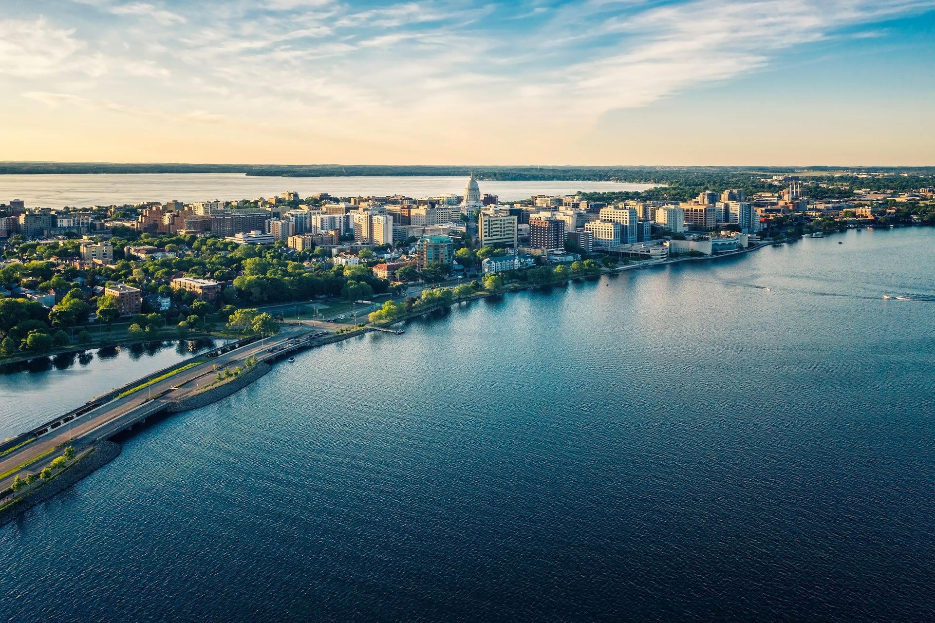 An aerial view of a city next to a large body of water.