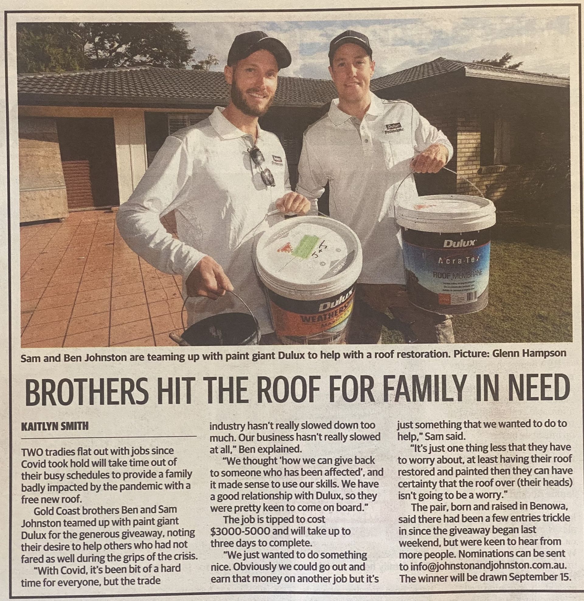Owners of Johnston & Johnston Restoration holding paint buckets  — Roofer in Southport QLD