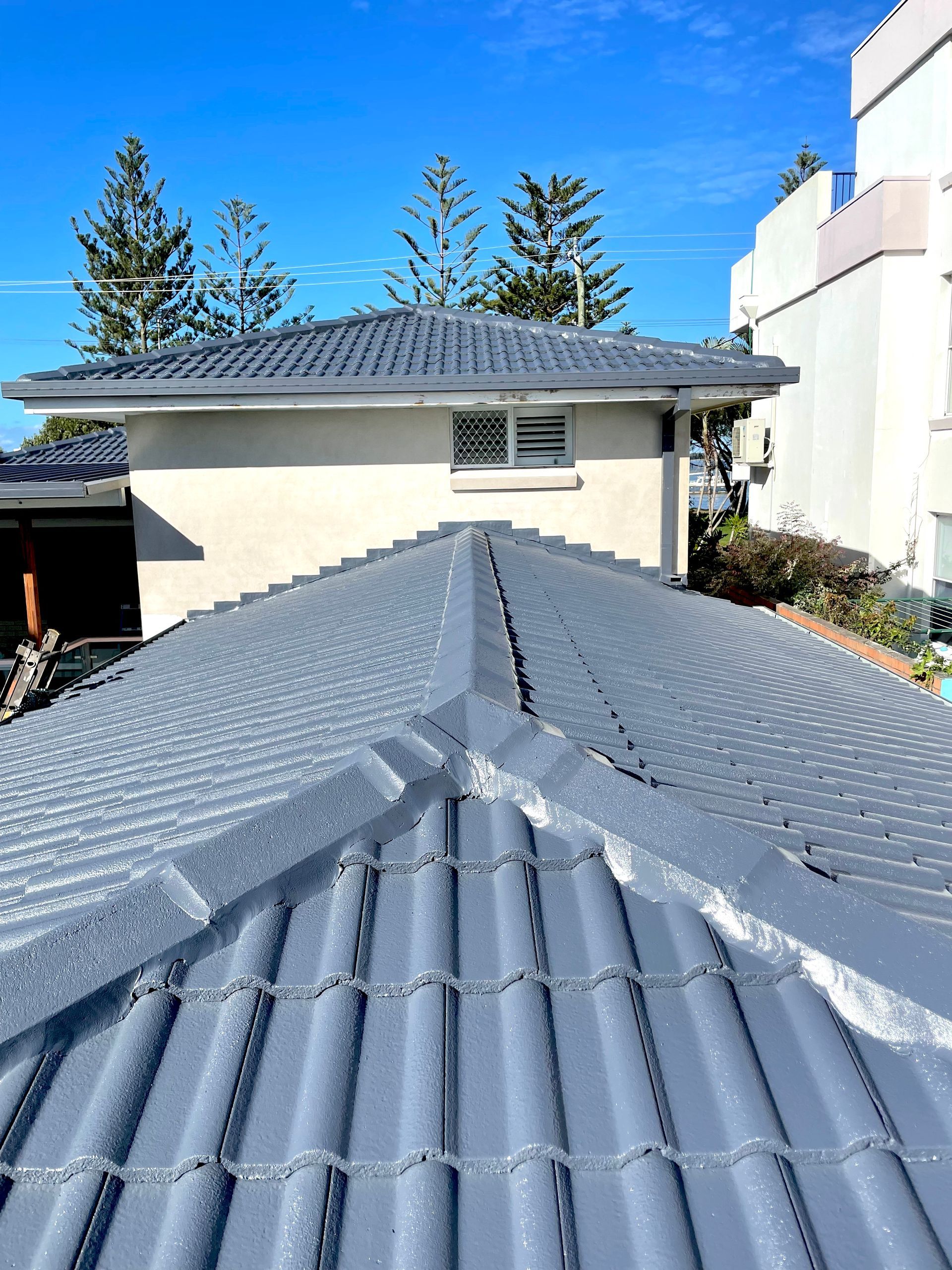 New grey roof — Roof Restoration in Southport QLD
