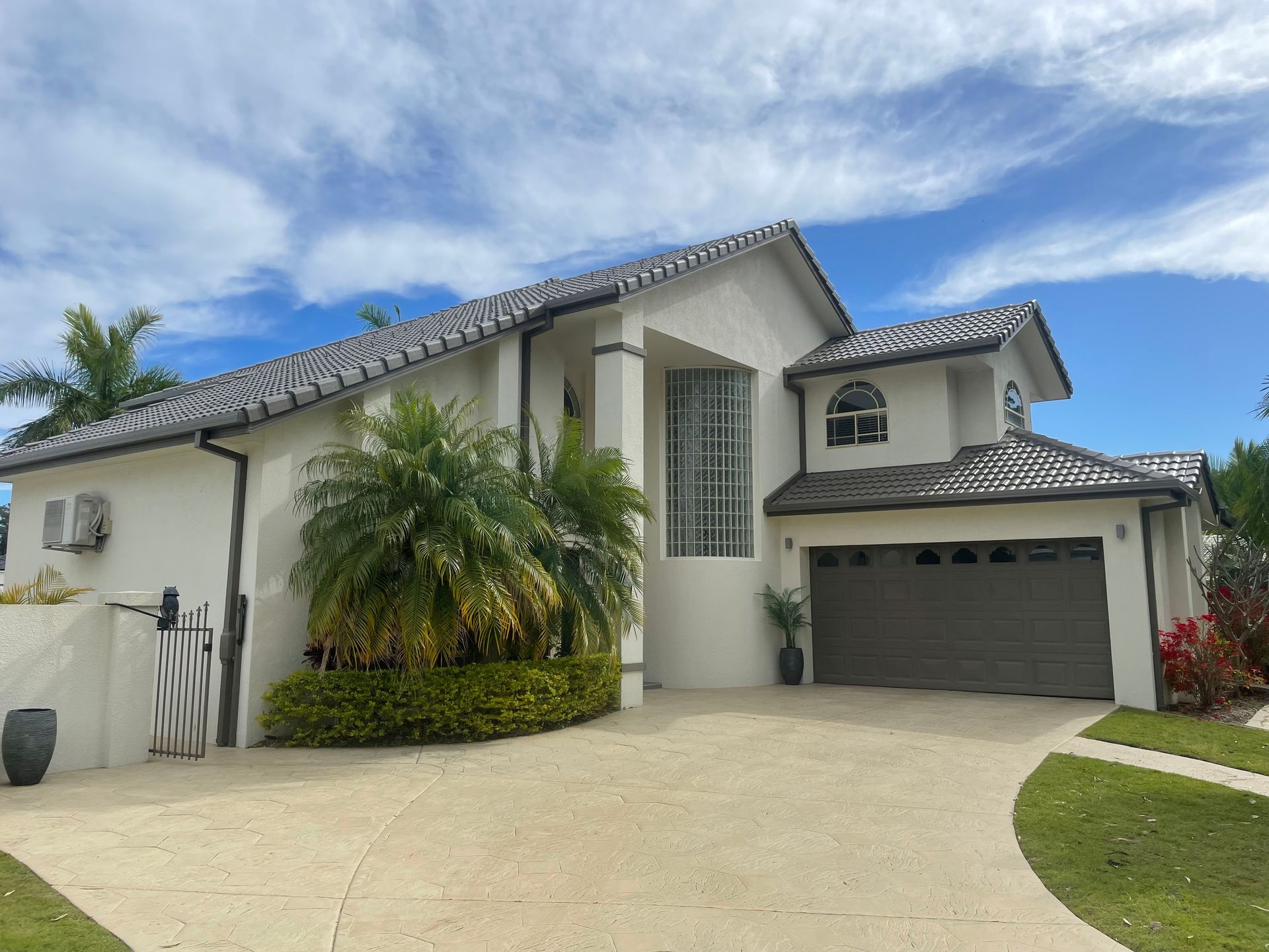 Artisan Painting a roof with Meticulous Craftsmanship — Roof Painting in Southport QLD