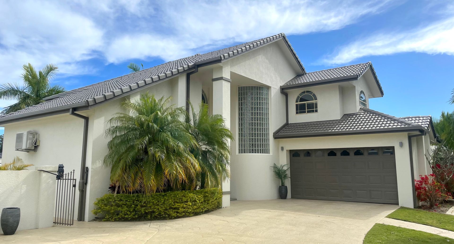 Contemporary Residence Construction Featuring a sleek metal roof — Painting Gutters in Southport QLD
